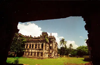 Nagarpur Zamindar Bari framed through a ruined window