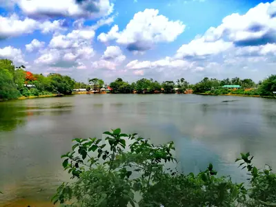 A large pond (dighi) under a cloudy sky at Sagardighi, Ghatail Upazila