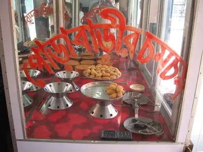 Porabarir chomchom in a sweet shop window, Tangail bus stand